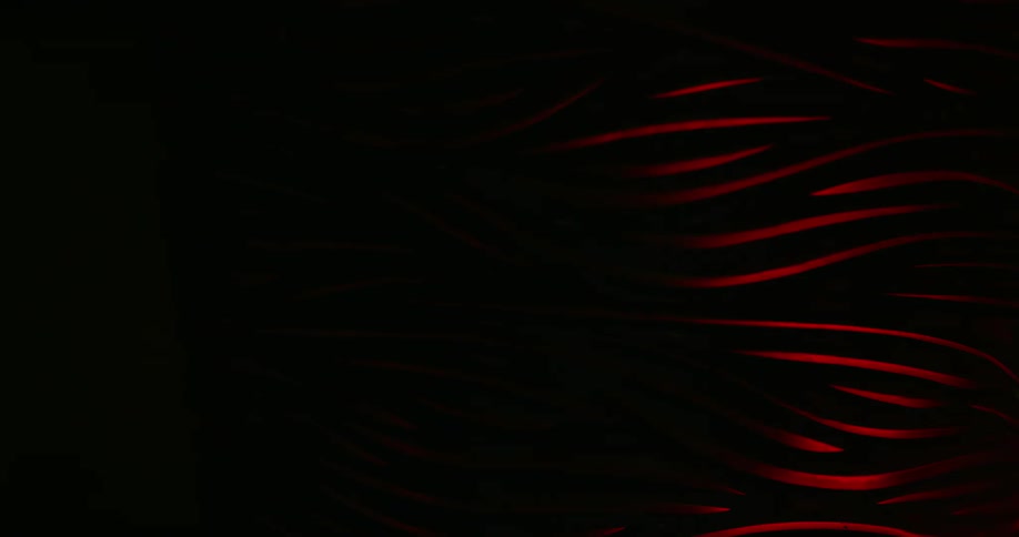 Curved lines on the surface of glassware dim on a dark room