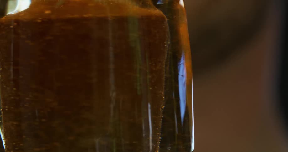 A molten glass is rotating on its axis