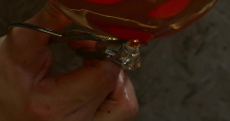 Scissors cutting a transparent object