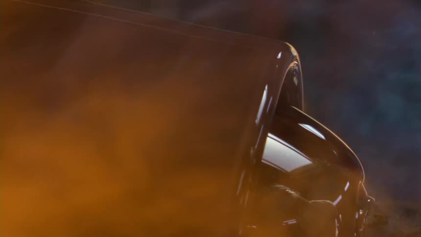 A piece of glassware turns surrounded by flames