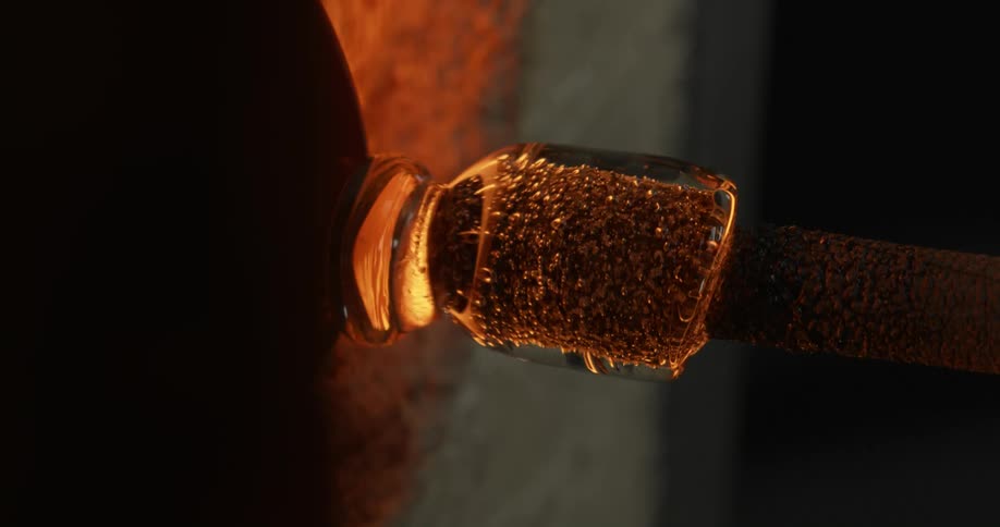 A piece of hot molten glass spinning in a furnace