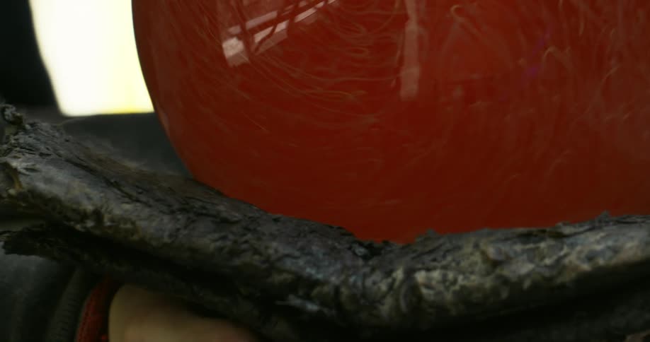 Light reflecting from a red balloon