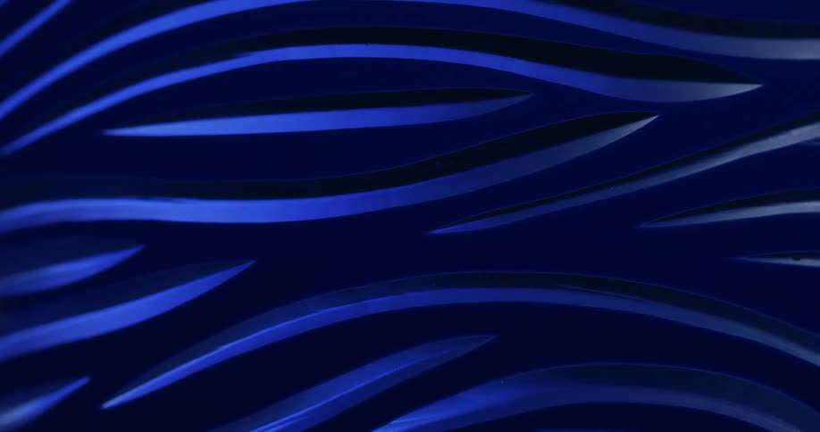 Lights and shadows over a carved blue piece