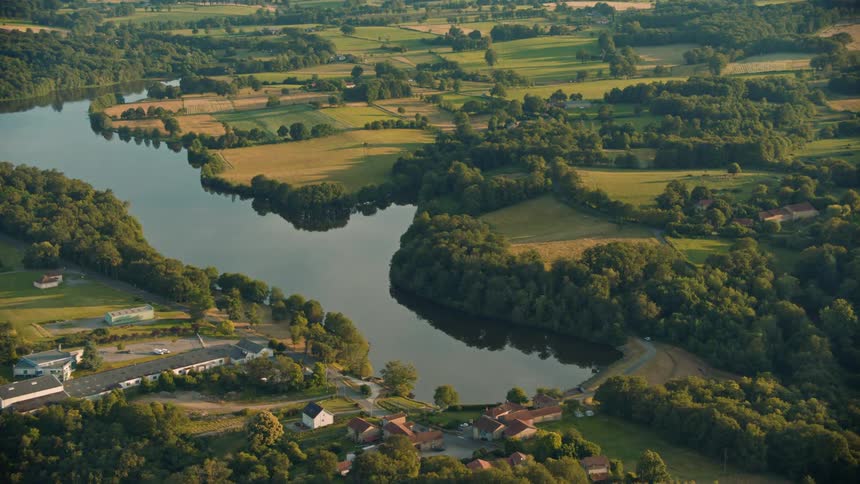The homes sit by the river