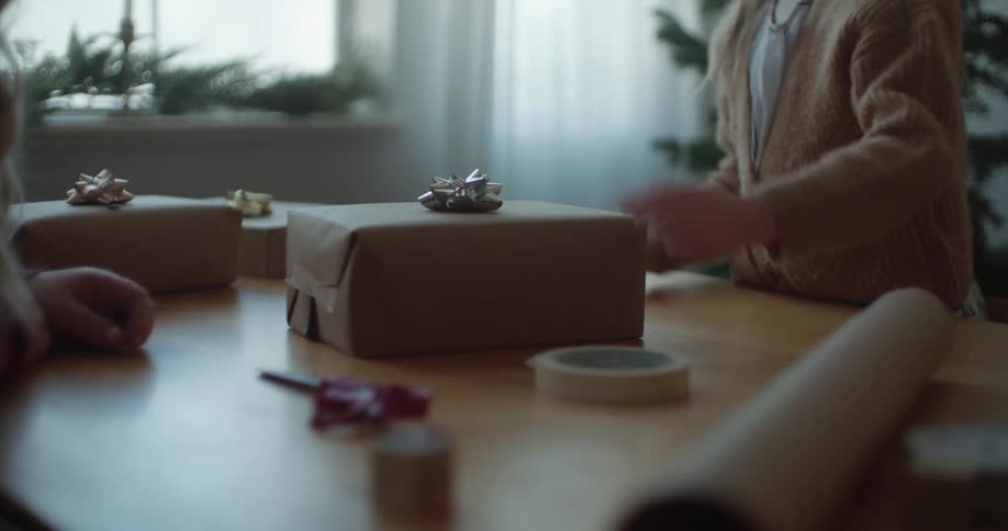 A girl is wrapping presents