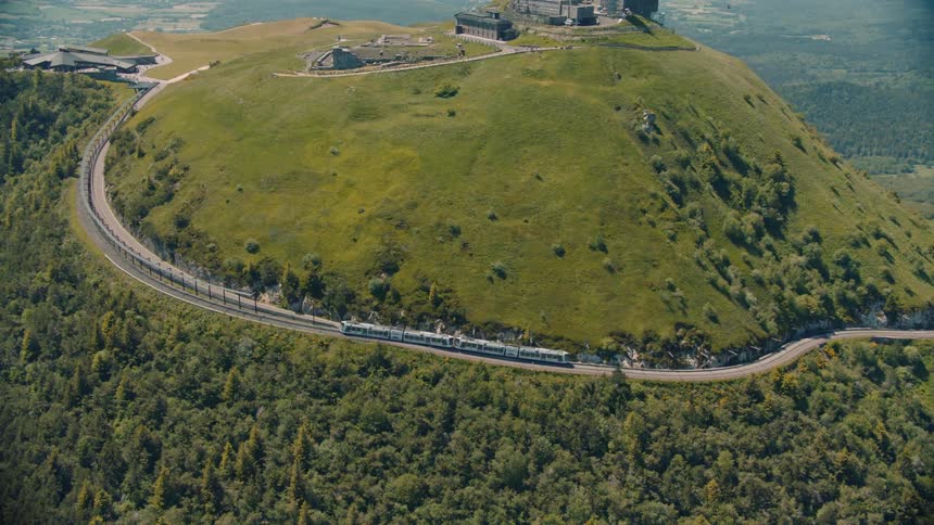 The train is heading uphill towards the castle