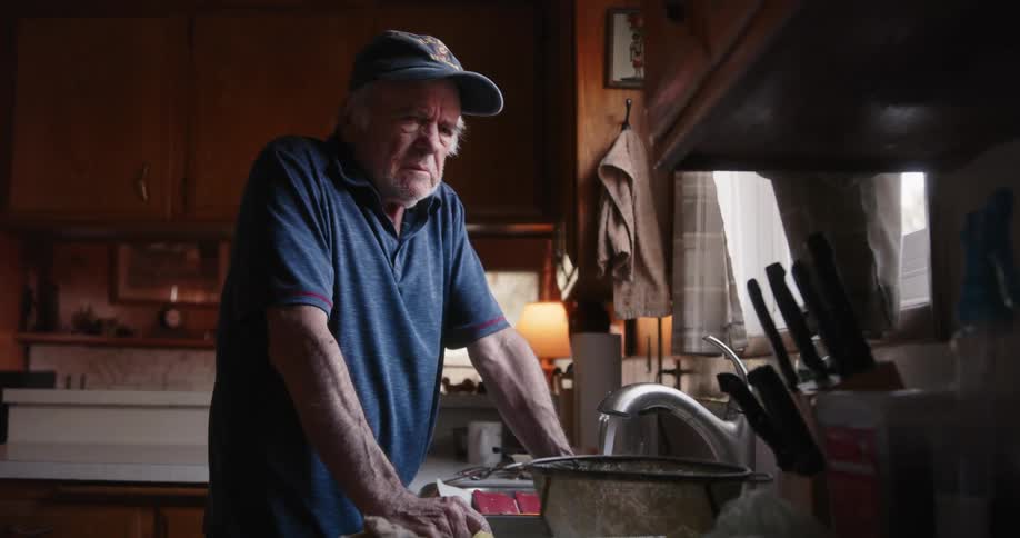 A man begins washing dishes