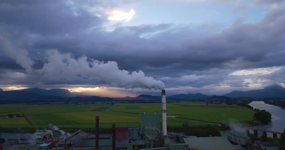 A factory is near the bridge on the river