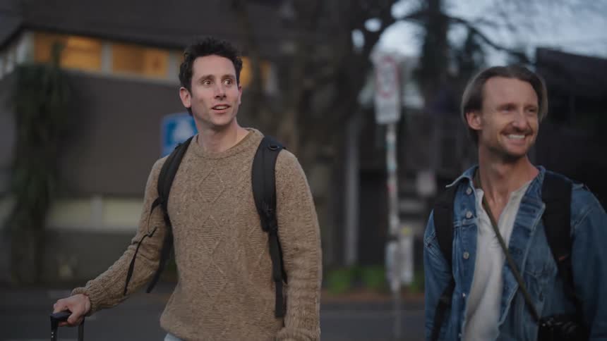 Two men are touring through the city