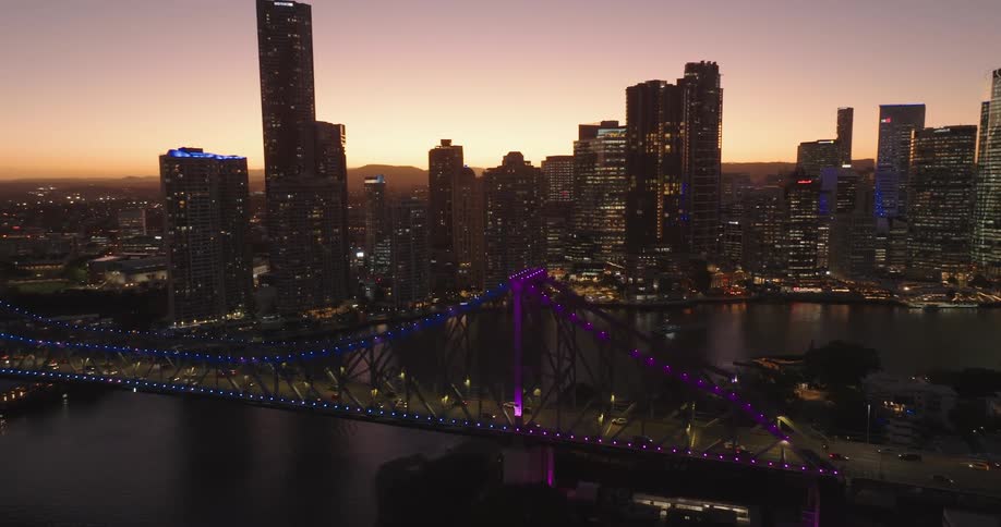Aerial of the illuminated bridge in the metropolitan city at night