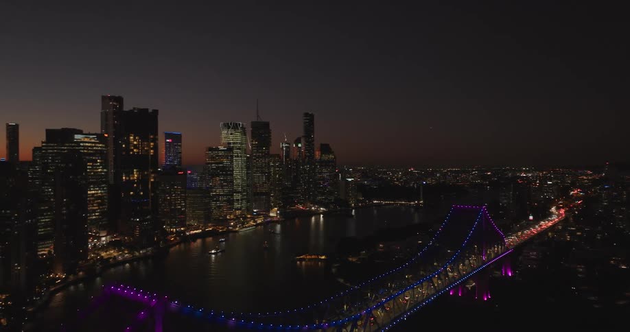The city is brightly lit at dusk