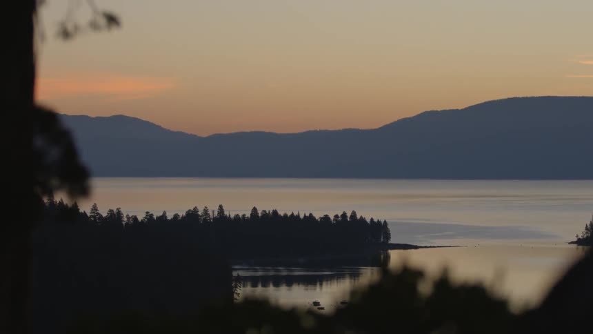 The sun is setting over this lake
