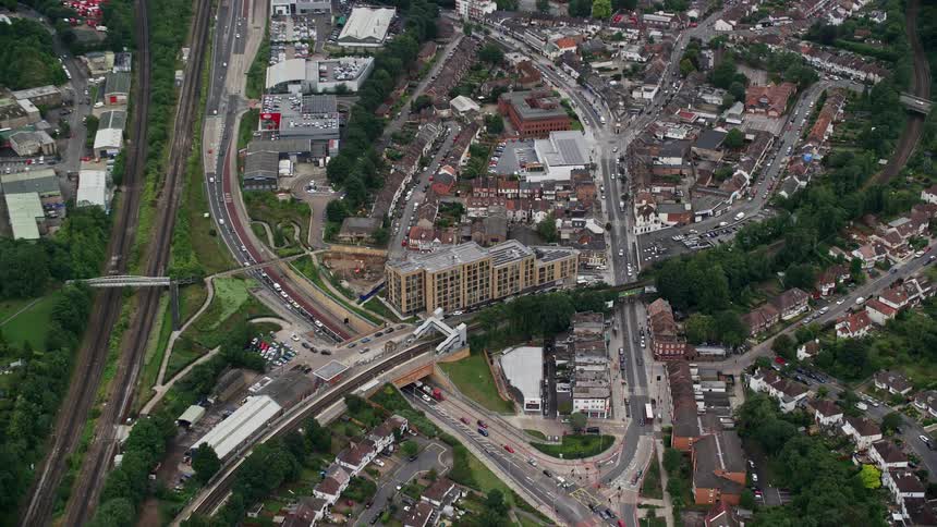 Aerial view of an urban city with roads and trees
