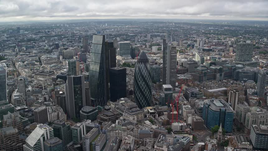 Aerial view of a city featuring lots of high rise buildings and skyscrapers