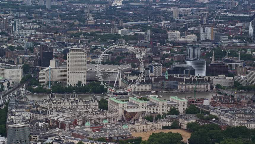 Aerial of ferris wheel in a metropolitan city