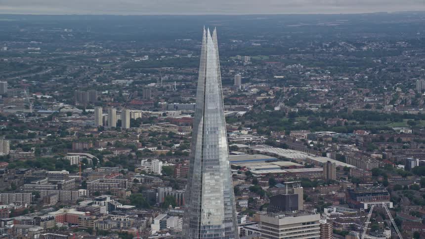 Aerial view of a tower amidst a metropolitan city