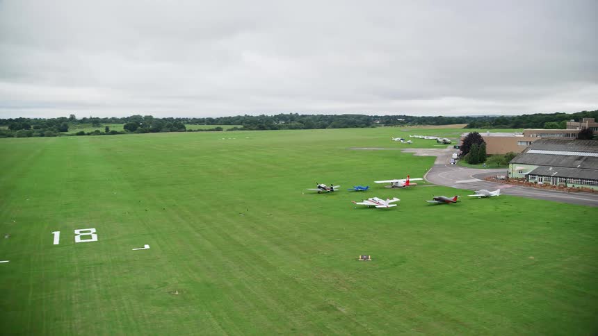 Aerial of a field with airplane in the countryside