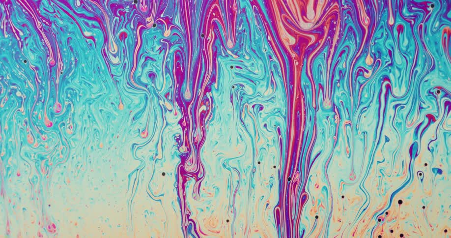 A liquid with many different colors is moving in several positions