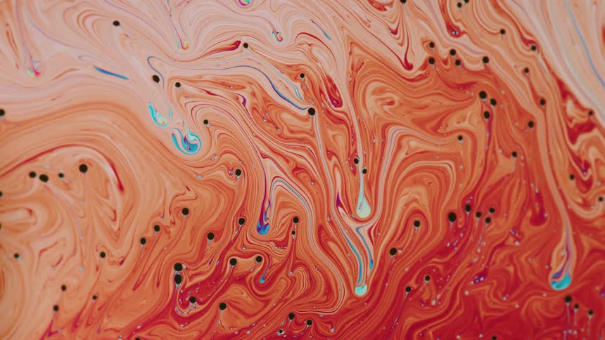 An orange and blue liquid like pain flowing distortedly with several black dots across it