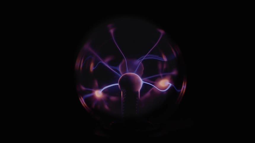 A plasma ball glowing with colorful sparks against a black background