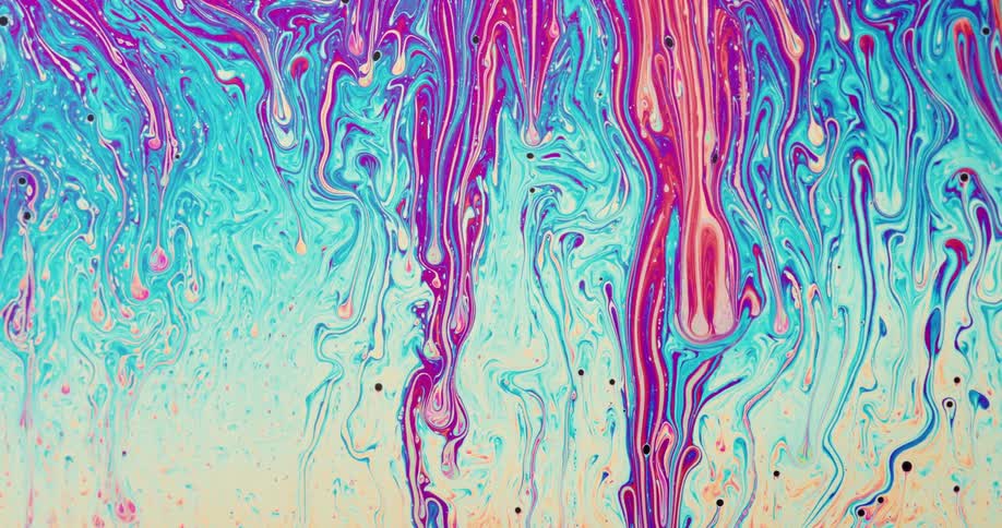 White dots pull dripping pink and purple stripes down over the blue and white colored mixture