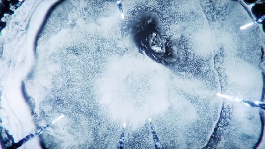 Several meteorites falling towards blue clouds suspended in outer space