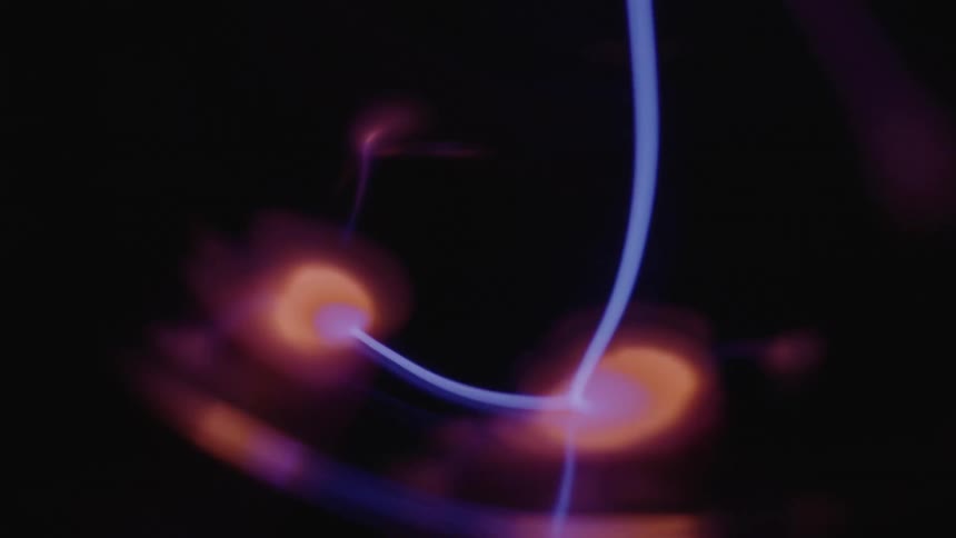 Some blue string moving over a round orange surface that looks like a cell