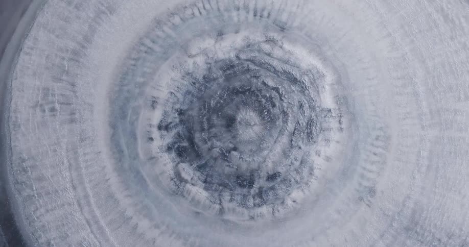A fluid flows and mixes in a surreal circular shaped pattern