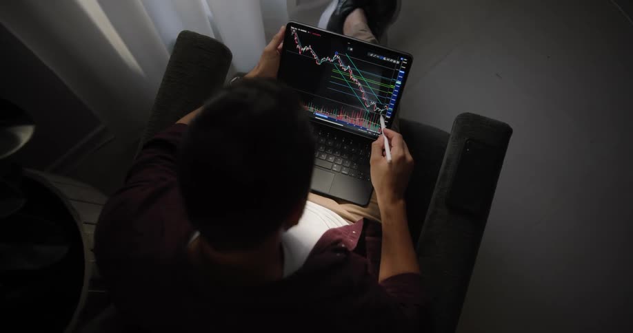 A man doing technical analysis on a stocks chart