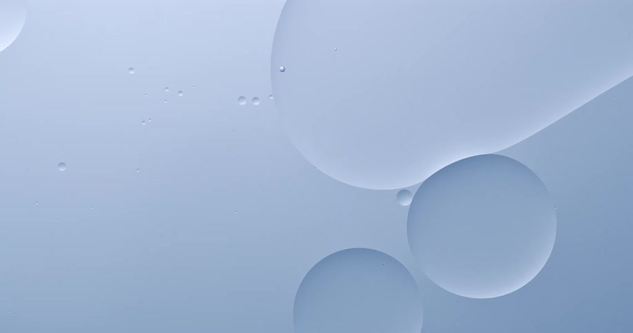 Large air bubbles float over a teal pastel background