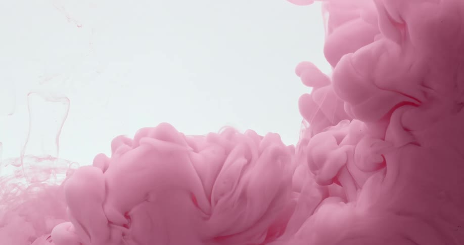 Pink liquid flowing in water