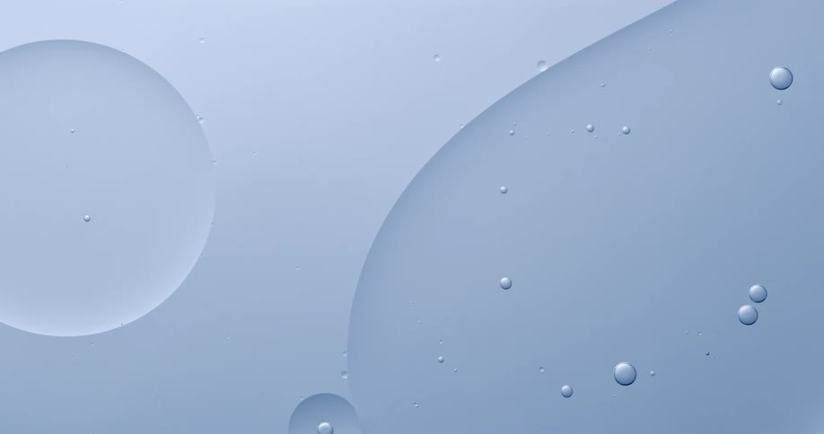 Circular bubbles floating in clear liquid
