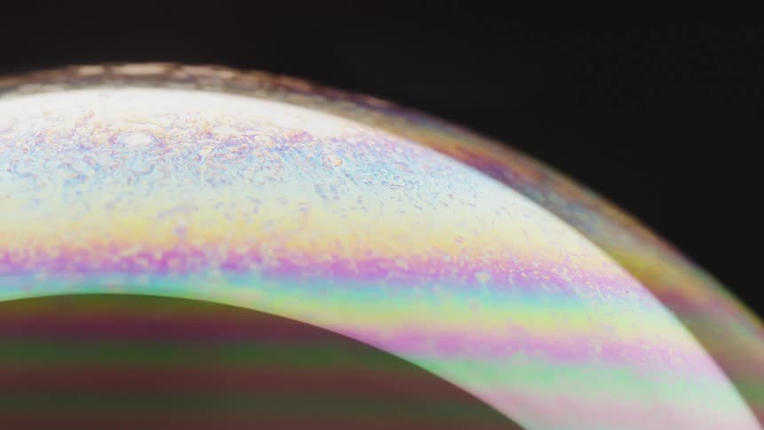 A planet reflecting different colors as it rotates