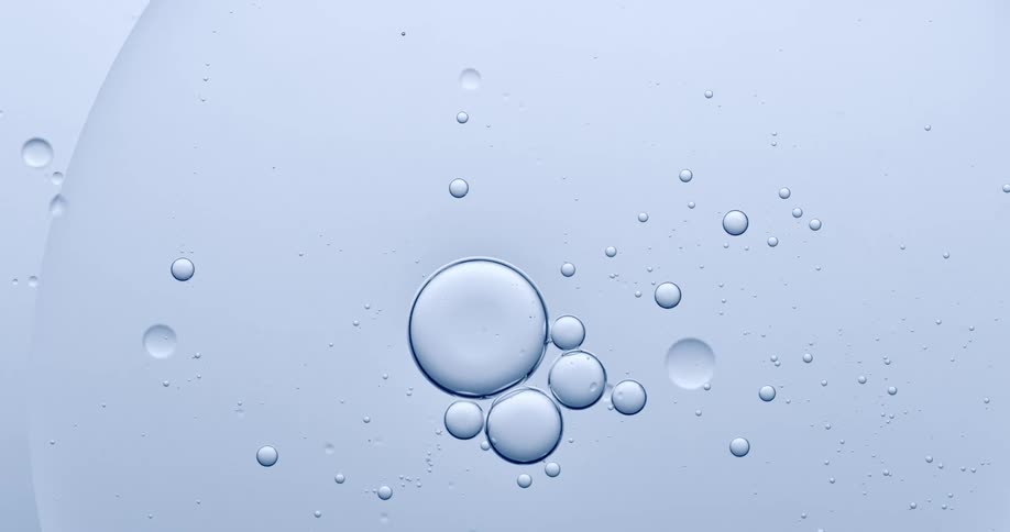 Liquid blue pain with burbles spinning in circle