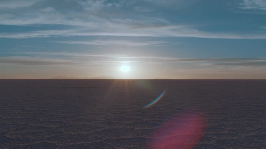 Sunlight illuminates a vast desert