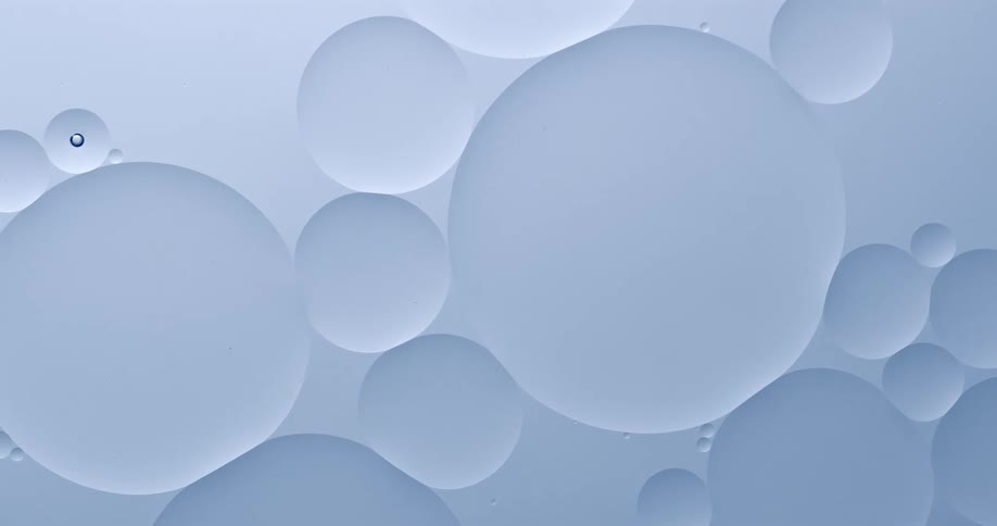 Bubbles in water flowing over white surface