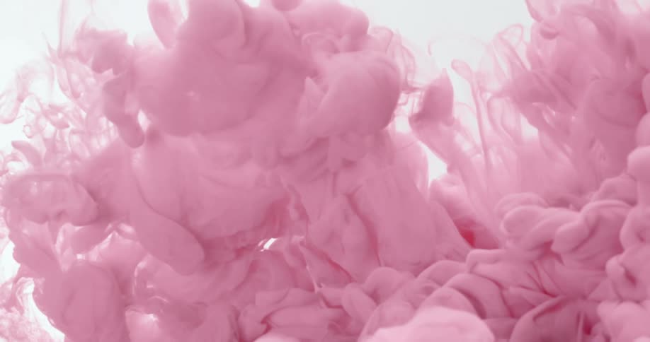 Pink ink floating in water