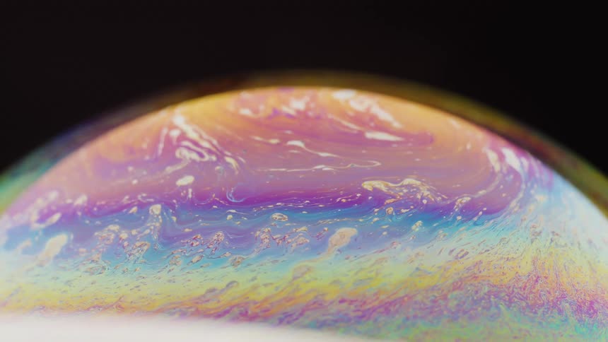 A sphere with different colors flowing around it like liquid