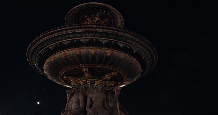 A large monument is under the night sky