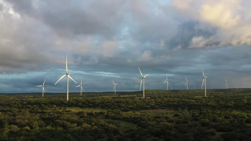 Wind turbines on grassland on a cloudy day