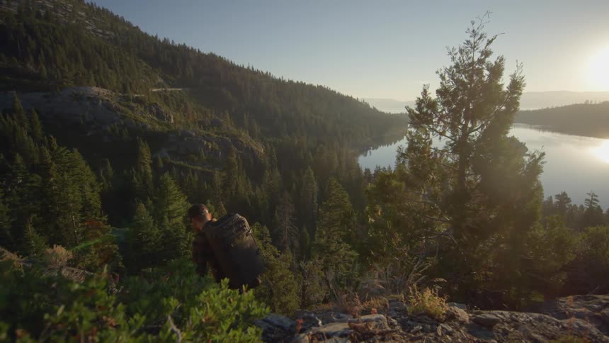 A man is climbing on a mountain top