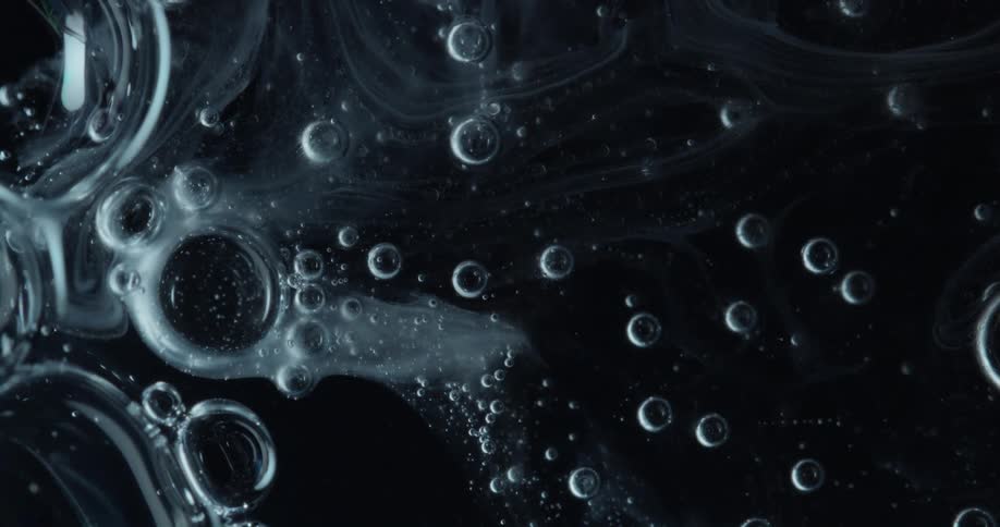 The bubbles slowly move in the liquid