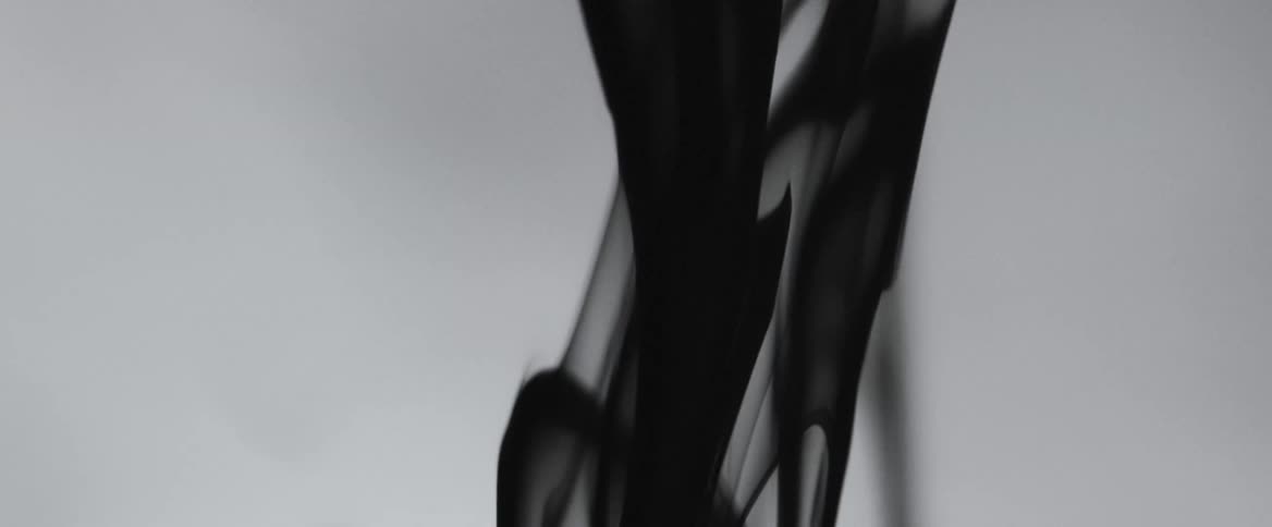 A smoky black fluid falling