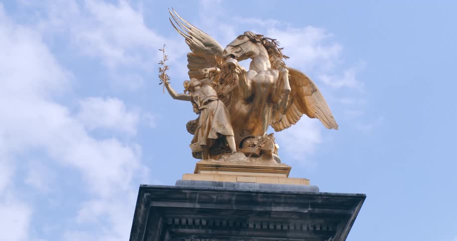Golden sculptures of a man and a pegasus