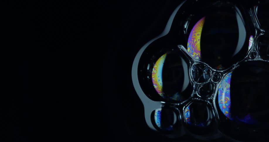 Bubbles floating on dark water
