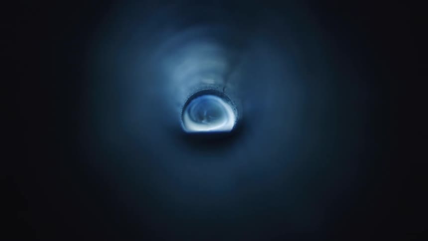 A small hole surrounded by special lighting effects as it gets darker and brighter