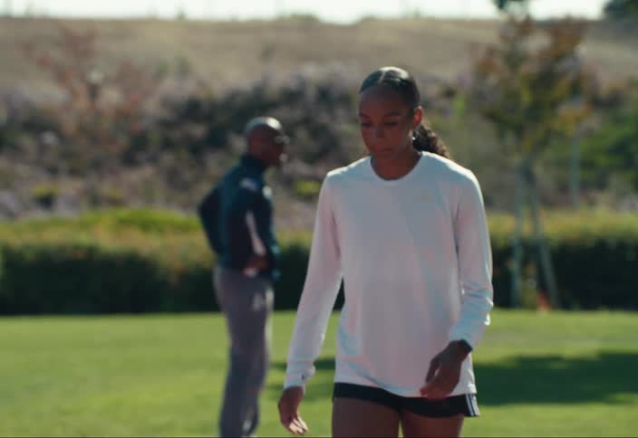 A woman warming up before a race at a track meet