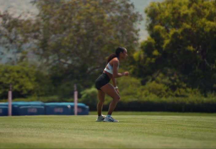 An athlete warms up for a workout on a field