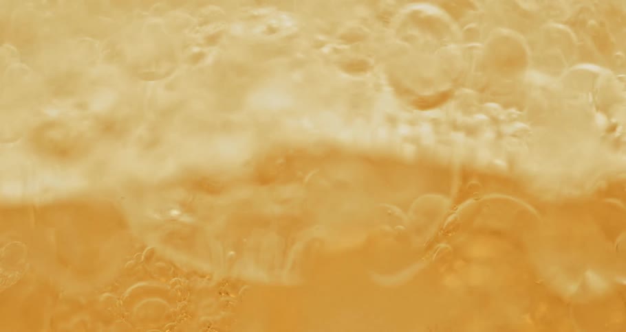 Bubbles in yellow beverage