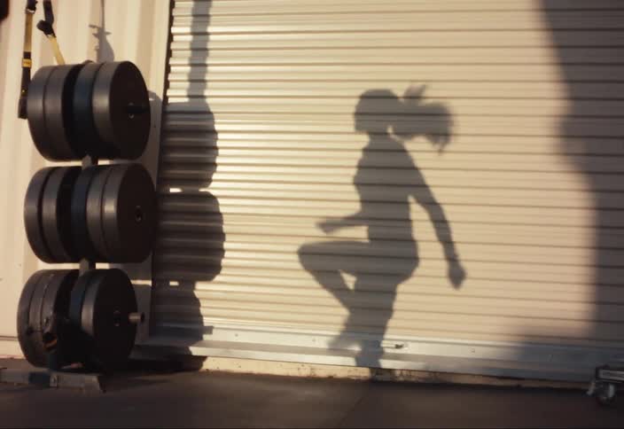 A woman training in an outdoor gym